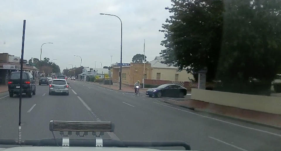 The cyclist can be seen riding in the bike lane along Belair Road in Adelaide’s south. Source: Facebook/ Dash Cam Owners Australia