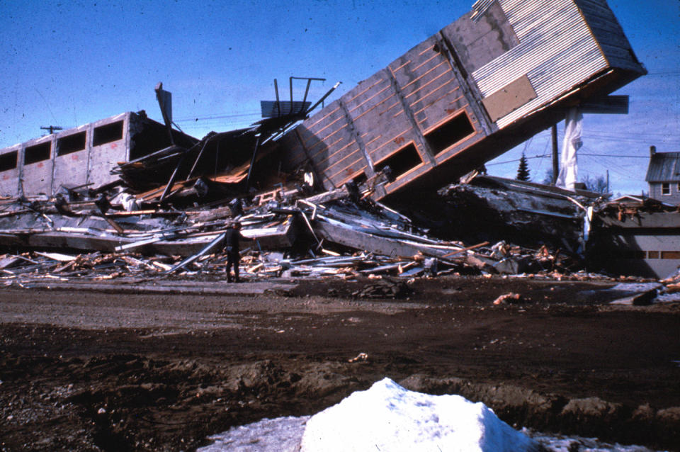 In this March 1964, photo released by the U.S. Geological Survey, the Four Seasons Apartments, a six-story lift-slab reinforced concrete building is shown cracked to the ground following an earthquake in Anchorage, Alaska. The building was under construction, but structurally completed at the time of the quake. North America's largest earthquake rattled Alaska 50 years ago, killing 15 people and creating a tsunami that killed 124 more from Alaska to California. The magnitude 9.2 quake hit at 5:30 p.m. on Good Friday, turning soil beneath parts of Anchorage into jelly and collapsing buildings that were not engineered to withstand the force of colliding continental plates. (AP Photo/U.S. Geological Survey)