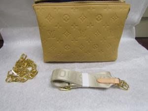 Counterfeit designer purse seized due to intellectual property rights violation.