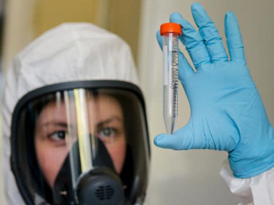 An employee shows new Russian vaccine at the Nikolai Gamaleya National Centre of Epidemiology and Microbiology in Moscow (AP)