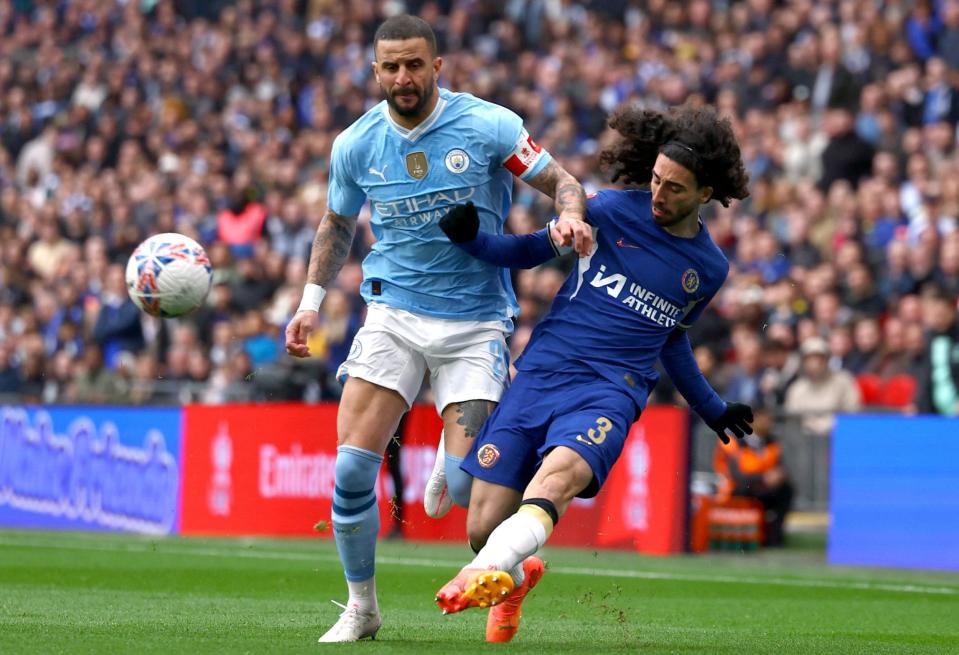 Cucurella is challenged by Walker