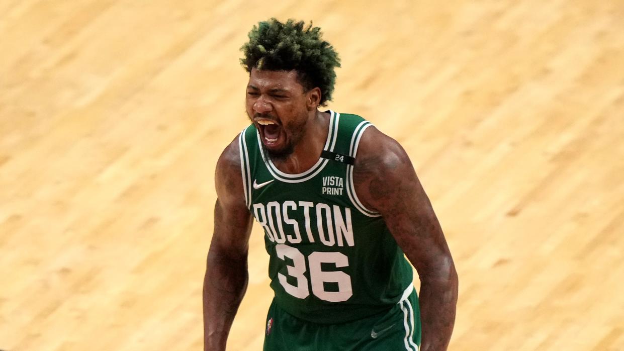  Marcus Smart #36 of the Boston Celtics reacts after a three point basket during the fourth quarter against the Miami Heat  