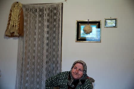 Bosniak Abida Avdic, an internally displaced person from Srebrenica, cries at her house in Mihatovici, near Tuzla, Bosnia and Herzegovina, October 2, 2018. REUTERS/Dado Ruvic