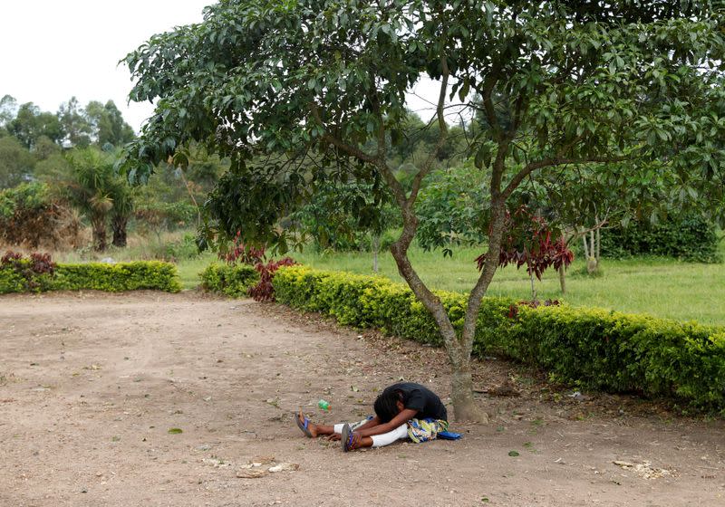 FILE PHOTO: The mother of a baby suspected of dying from Ebola, cries outside a hospital in Beni