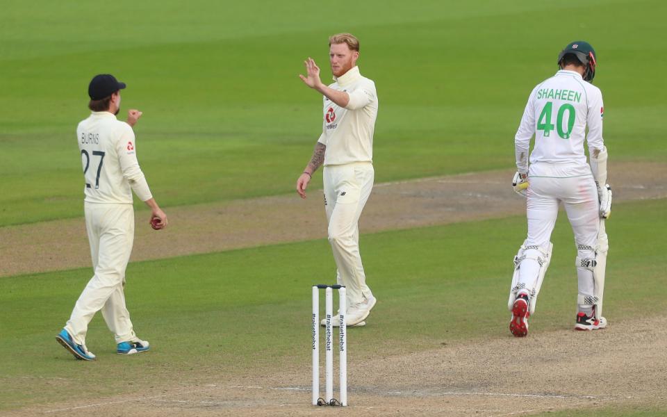 Ben Stokes of England celebrates with Rory Burns after taking the wicket of Shaheen Afridi  - GETTY IMAGES