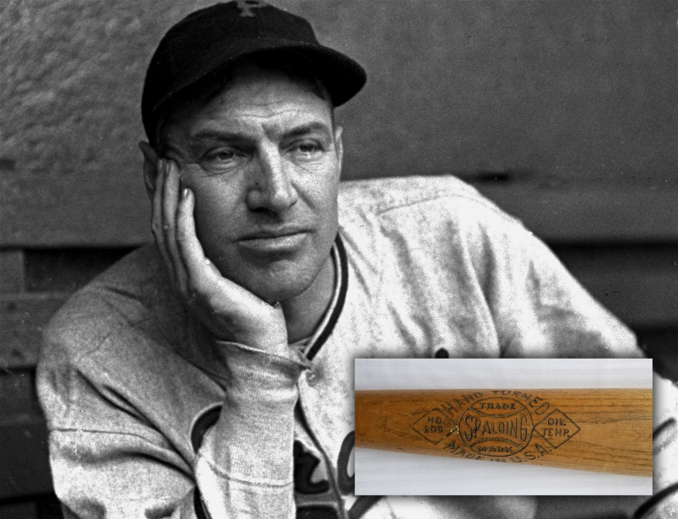 Pirates Hall of Famer Pie Traynor and the bat of his that was recently found in a thrift shop. (AP / Post Gazette)