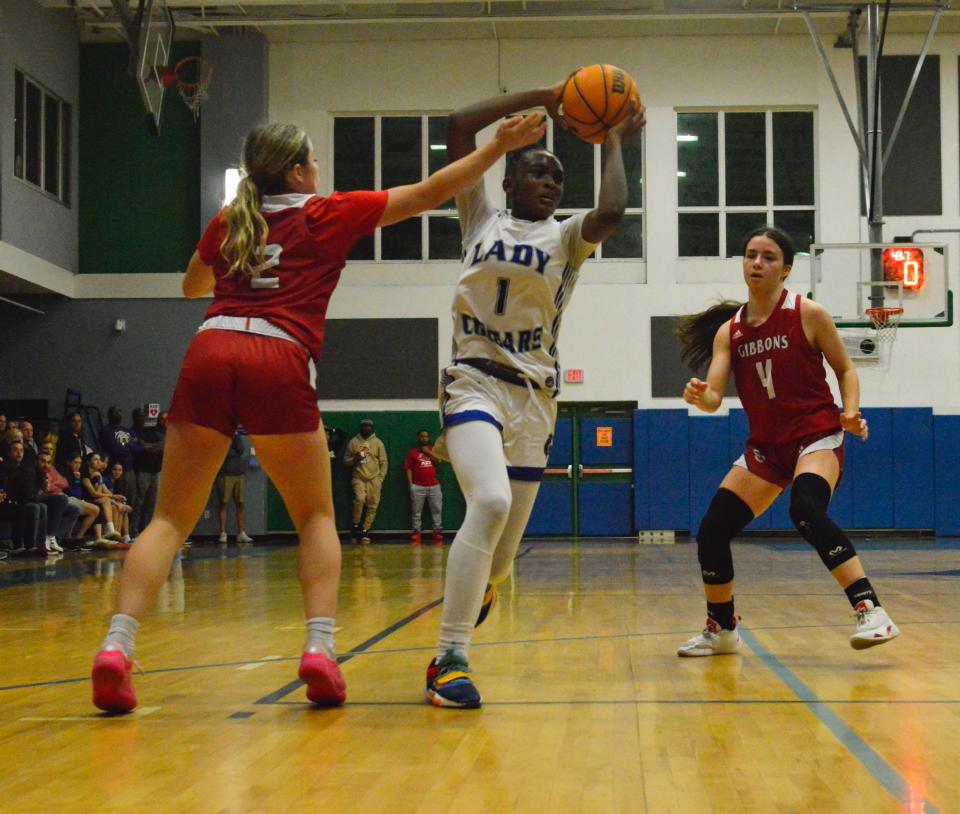 Somerset Canyon's Alana Pinnock (1) maneuvers through Cardinal Gibbons defenders on Feb. 19, 2024.