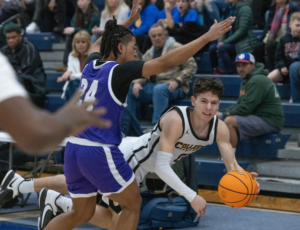 Achieve’s Anthony Mauro passes in as he goes down in first half action. College Achieve Asbury Park vs Newark Tech for NJSIAA Group 1 Title inToms River, NJ on March 10, 2024.