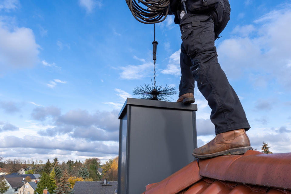 someone cleaning a chimney