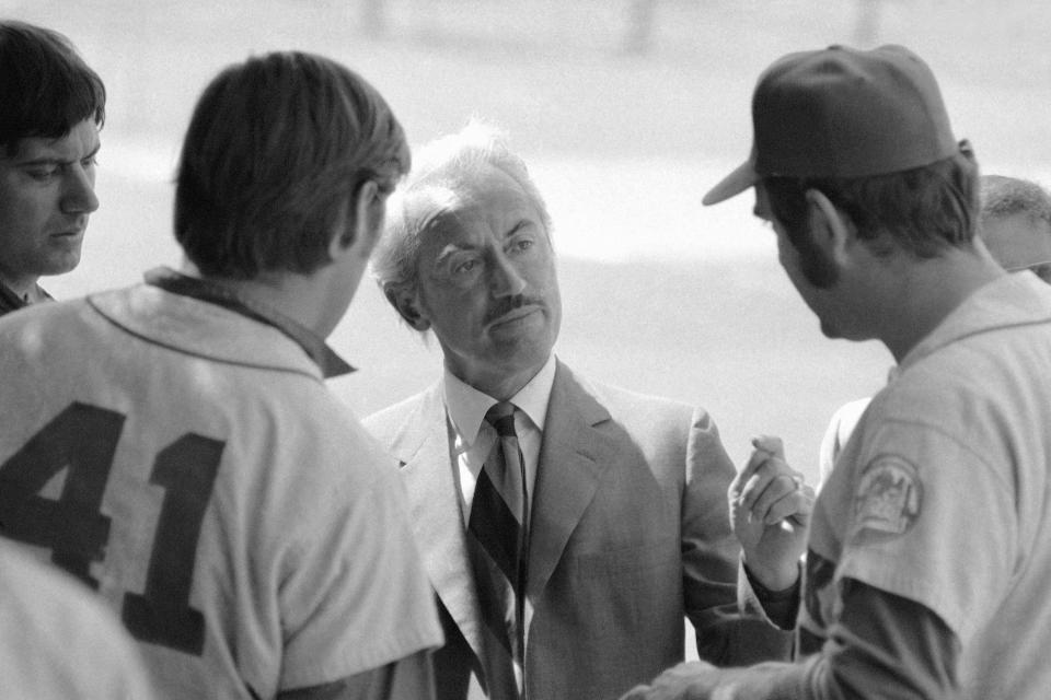 FILE - This March 11, 1972, file photo shows Marvin Miller, executive director of the Major League Players Association, talking to New York Mets' Tom Seaver (41), and Ed Kranepool, in St. Petersburg, Fla. Miller, the union leader who revolutionized baseball by empowering players to negotiate multimillion-dollar contracts and to play for teams of their own choosing, was elected to baseball's Hall of Fame on Sunday, Dec. 8, 2019. (AP Photo/File)