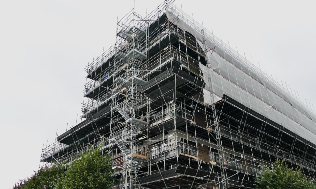 <span>Unsafe cladding being removed from Chatham House flats in Reading, Berkshire.</span><span>Photograph: Geoffrey Swaine/Rex</span>