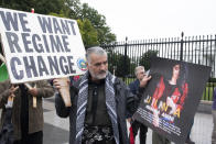 A member of the District of Columbia's Kurdish community demonstrates in front of the White House in Washington, Saturday, Oct. 1, 2022, after the death of Mahsa Amini, a 22-year-old woman who had been detained by the morality police in the capital, Tehran, for allegedly wearing her mandatory Islamic headscarf too loosely. (AP Photo/Cliff Owen)