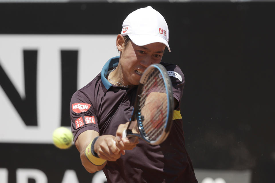 Japan's Kei Nishikori returns the ball to Italy's Fabio Fognini during their match at the Italian Open tennis tournament, in Rome, Monday, May 10, 2021. (AP Photo/Gregorio Borgia)