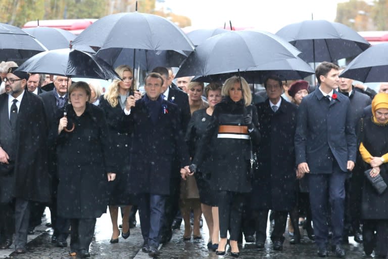 French President Emmanuel Macron and his wife Brigitte arrived at the Arc de Triomphe with other world leaders