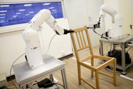 Robots assemble an Ikea chair at Nanyang Technological University (NTU) in Singapore April 17, 2018. Picture taken April 17, 2018. NTU/Handout via REUTERS