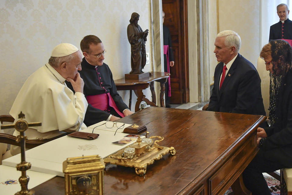 Pope Francis shares a word with US Vice President Mike Pence, second from right, on the occasion of their private audience, at the Vatican, Friday, Jan. 24, 2020. Pence told Pope Francis, “You made me a hero" back home by granting him a private audience at the Vatican on Friday. (Alessandro Di Meo/Pool Photo via AP)