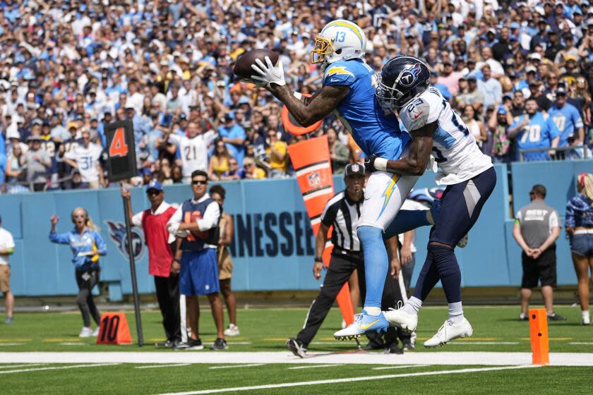 Chargers wide receiver Keenan Allen makes a touchdown catch over Tennessee Titans cornerback Tre Avery.