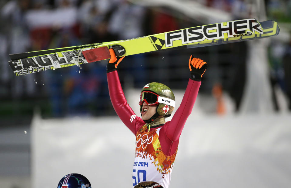 Poland's Kamil Stoch celebrates winning the gold medal during the men's normal hill ski jumping final at the 2014 Winter Olympics, Sunday, Feb. 9, 2014, in Krasnaya Polyana, Russia. (AP Photo/Gregorio Borgia)