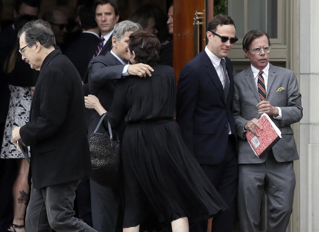 Andy Spade, right, leaves his wife's funeral service: AP