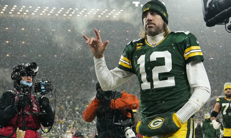 Aaron Rodgers walks off the field on Saturday night.