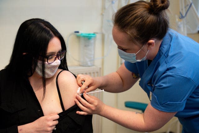 Elle Taylor receives an injection of the Moderna vaccine from nurse Laura French, at the West Wales General Hospital in Carmarthen