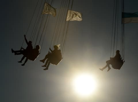 There is a variety of fairground rides to enjoy - Credit: CHRISTOF STACHE/GETTY