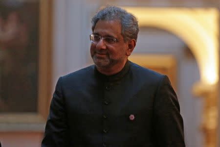 FILE PHOTO: Pakistan's Prime Minister Shahid Khaqan Abbasi arrives to attend The Queen's Dinner during The Commonwealth Heads of Government Meeting (CHOGM), at Buckingham Palace in London on April 19, 2018. Daniel Leal-Olivas/Pool via Reuters