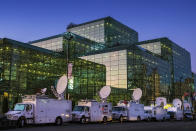 FILE - In this Nov. 6, 2016 file photo, television satellite trucks line up outside the Jacob K. Javits Convention Center in New York as preparations continued inside for Democratic presidential nominee Hillary Clinton's election night rally. On Saturday, March 21, 2020, New York Gov. Andrew Cuomo said the state is looking to see if the venue, normally home to the auto show and other big events, could be suitable for 1,000 requested field hospital beds that would be supplied by FEMA in a "tent configuration" with equipment and staff. (AP Photo/J. David Ake, File)