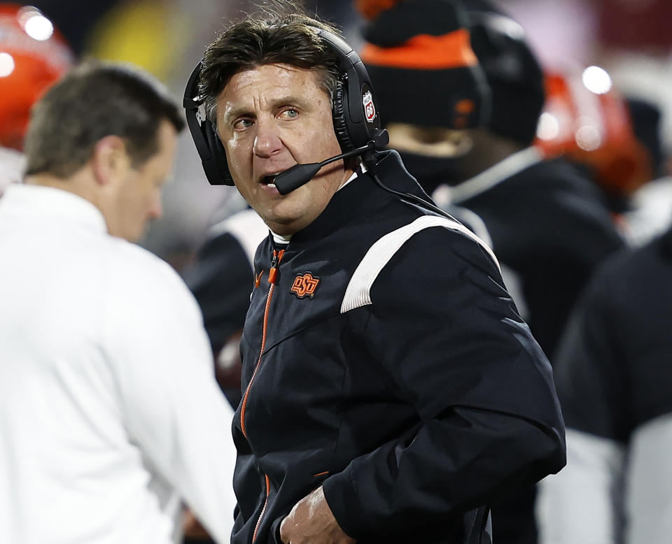 FILE - Oklahoma State head coach Mike Gundy stands on the sideline during the second half of an NCAA college football game against Oklahoma, Nov. 19, 2022, in Norman, Okla. “I think that we have the most exciting conference right now, because it wouldn't be fair for any of us to say that we actually know what's going to happen in Big 12 Conference play this year," said Gundy, the league's longest-tenured coach in his 19th season. (AP Photo/Alonzo Adams, File)