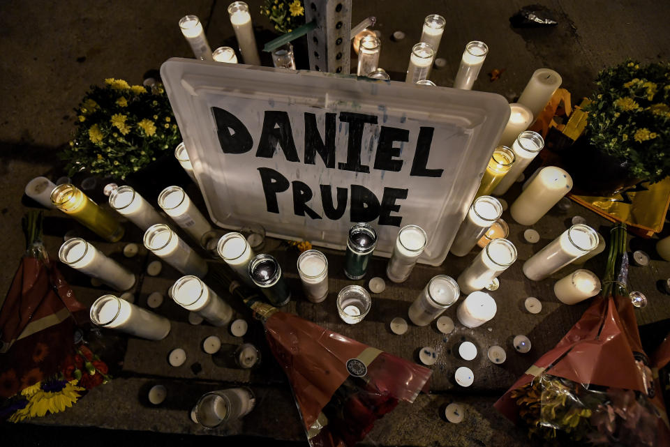 Pictured is a makeshift memorial with Daniel Prude name surrounded by many candles.