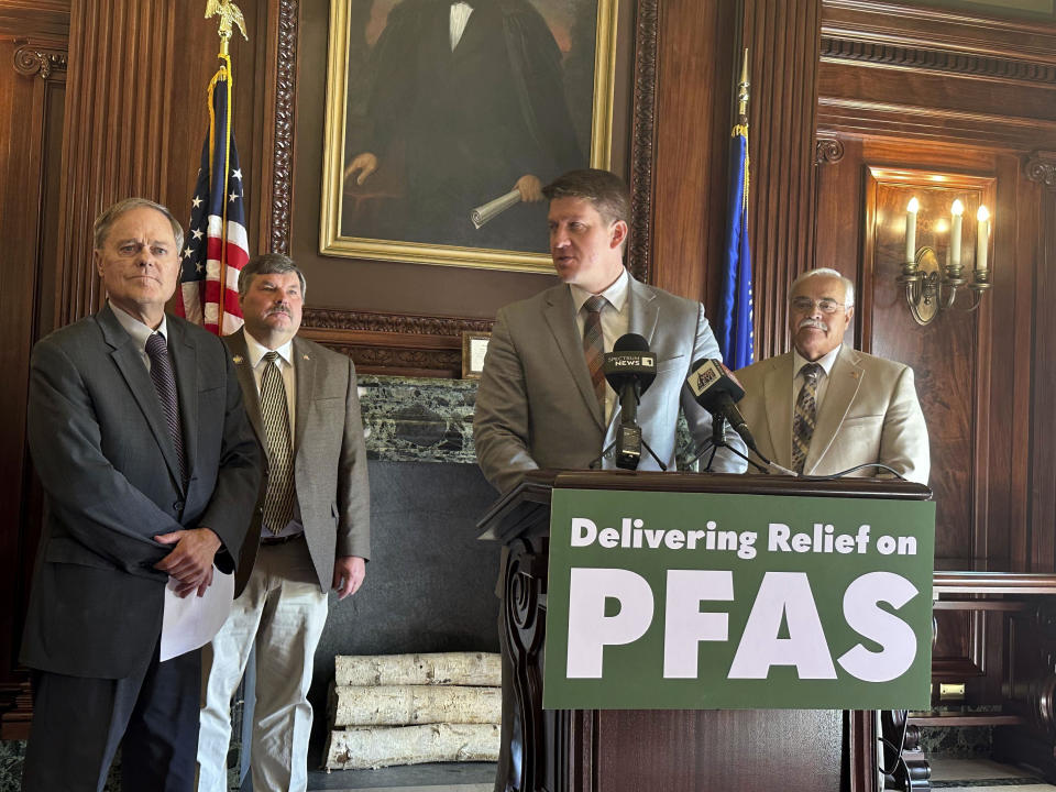 Sen. Rob Cowles, from left, Rep. Rob Swearingen, Sen. Eric Wimberger, at podium, and Rep. Jeff Mursau address the media as they introduce a revised version of their bill to combat PFAS contamination on Wednesday, Oct. 11, 2023. in the state Capitol in Madison, Wis. (Todd Richmond/AP Photo)