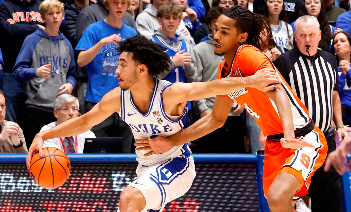 Duke’s Jared McCain (0) keeps the ball from Syracuse’s Chris Bell (4) during the second half of Duke’s 86-66 victory over Syracuse at Cameron Indoor Stadium in Durham, N.C., Tuesday, Jan. 2, 2024.