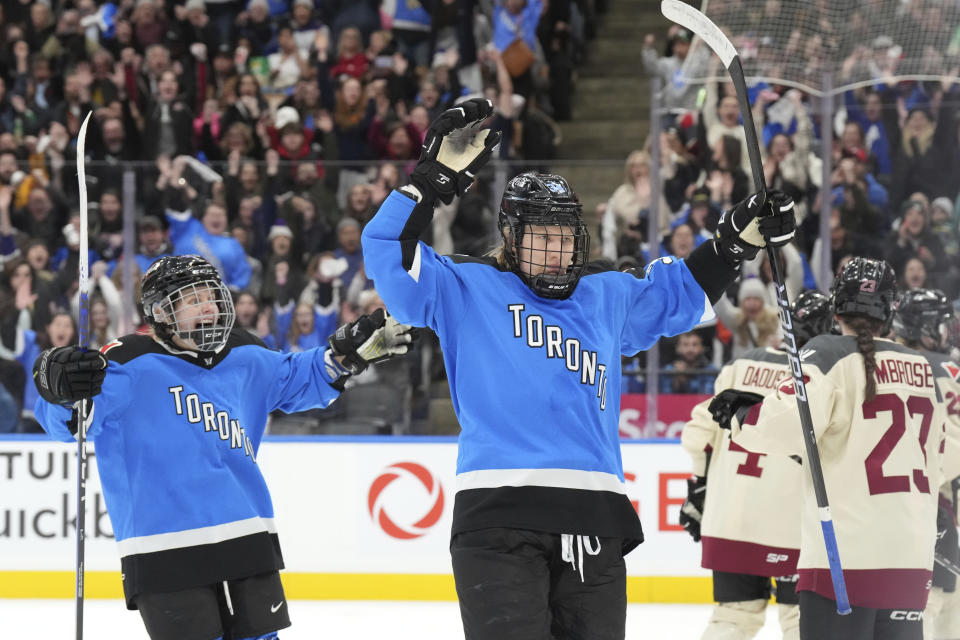 Toronto's Hannah Miller, center, celebrates after scoring against Montreal during the third period of a PWHL hockey game Friday, Feb. 16, 2024, in Toronto. (Chris Young/The Canadian Press via AP)