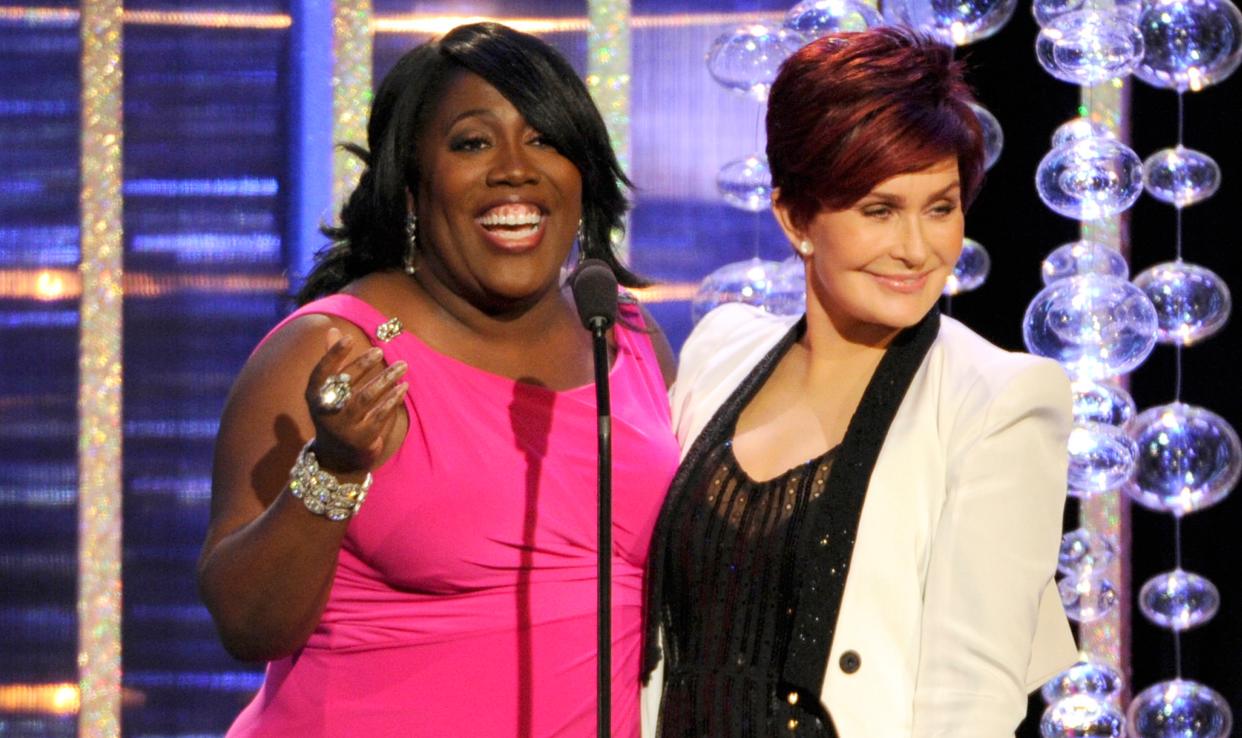 Sheryl Underwood, left, and Sharon Osbourne present the award for outstanding lead actor in a drama series at the 41st annual Daytime Emmy Awards at the Beverly Hilton Hotel on Sunday, June 22, 2014, in Beverly Hills, Calif. (Photo by Chris Pizzello/Invision/AP)