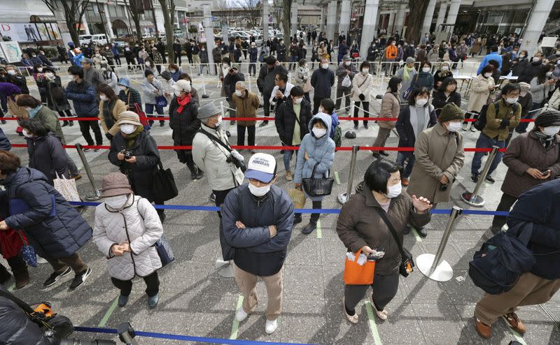 People try to watch Tokyo 2020 Olympics Flame of Recovery tour in Fukushima