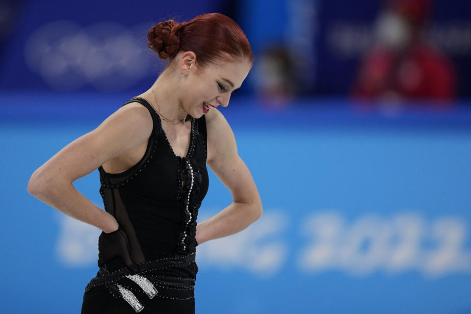 Alexandra Trusova, of the Russian Olympic Committee, reacts after competing in the women's free skate program during the figure skating competition at the 2022 Winter Olympics, Thursday, Feb. 17, 2022, in Beijing. (AP Photo/David J. Phillip)