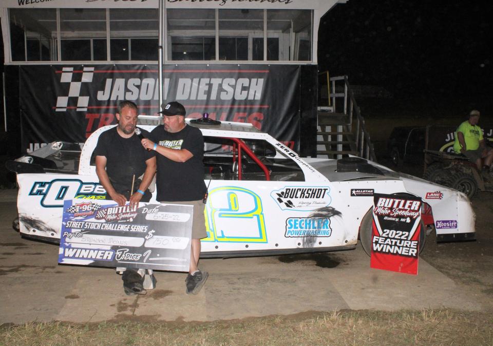 Butler Motor Speedway announcer Nathan Wilber (right) interviews Bronson Means after his Elite General Contracting street stock feature win.