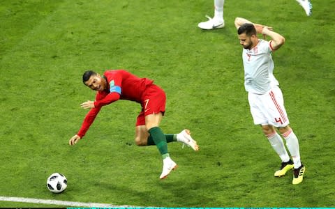 Ronaldo is tripped by Nacho - Credit: Michael Steele/Getty Images