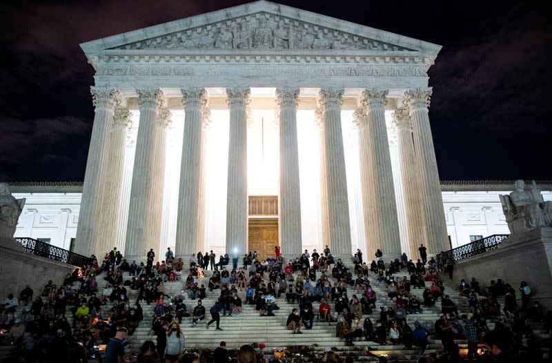 People gather in front of the U.S. Supreme Court following the death of U.S. Supreme Court Justice Ruth Bader Ginsburg, in Washington