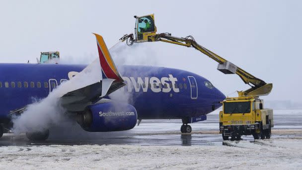 PHOTO: Integrated Deicing Services deices a Southwest Airlines plane before takeoff at Salt Lake City International Airport, Feb. 22, 2023, in Salt Lake City. (Rick Bowmer/AP)