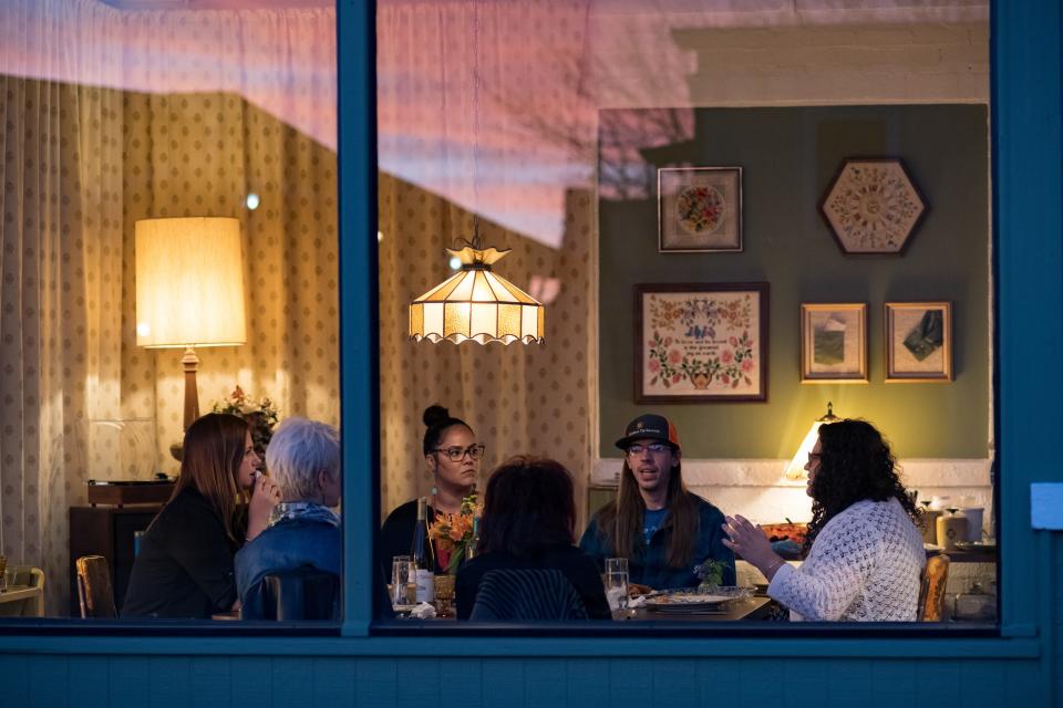 Julia Franklin's 2019 installation, "Illuminated," located in Valley Junction, was part of potluck dinner parties for strangers and friends that converted the space into a 1970s, early 1980s dining room.