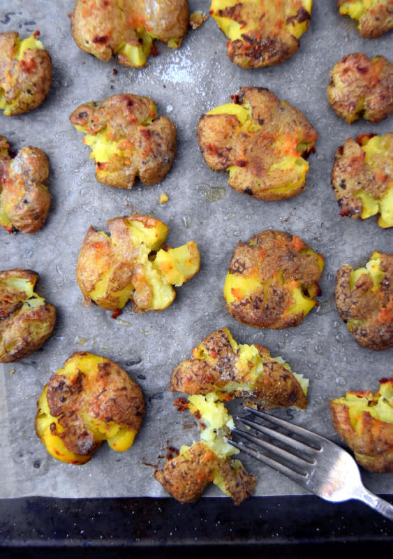 <p>Uproot Kitchen</p><p>These four-ingredient Crispy Garlic Smashed Potatoes are a simple side you won’t be able to stop eating. Each crispy, garlic-infused bite will get you hooked on this recipe.</p><p><strong>Get the recipe: <a href="https://uprootkitchen.com/2016/02/17/crispy-garlic-smashed-potatoes/" rel="nofollow noopener" target="_blank" data-ylk="slk:Crispy Garlic Smashed Potatoes;elm:context_link;itc:0;sec:content-canvas" class="link ">Crispy Garlic Smashed Potatoes</a></strong></p>