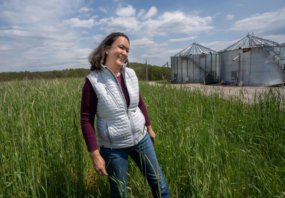 Doris Scully walks through a field of ryegrass on her family farm in Spencer.