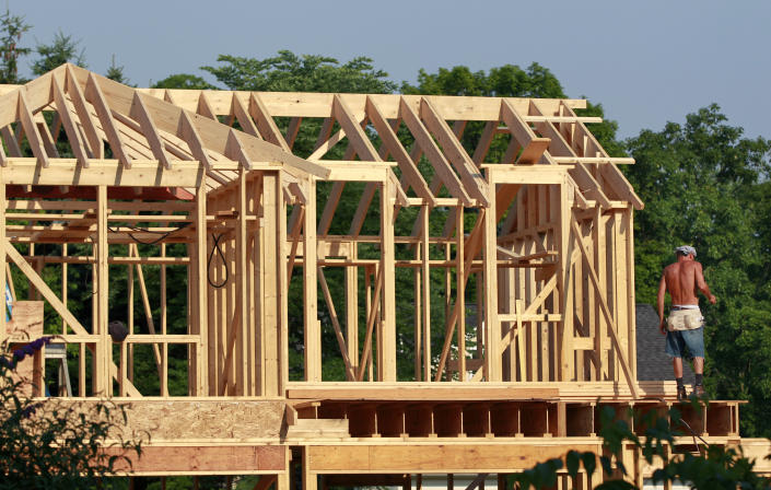 In this Wednesday, June 20, 2012, photo, a worker stands in the early-morning sunlight on a home construction project in Newtown, Pa., Wednesday, June 20, 2012. U.S. builders broke ground on the most new homes and apartments in nearly four years last month, the latest evidence of a slow housing recovery. The Commerce Department said Wednesday that housing starts rose 6.9 percent in June from May to a seasonally adjusted. annual rate of 760,000. That's the highest since October 2008. (AP Photo/Mel Evans)