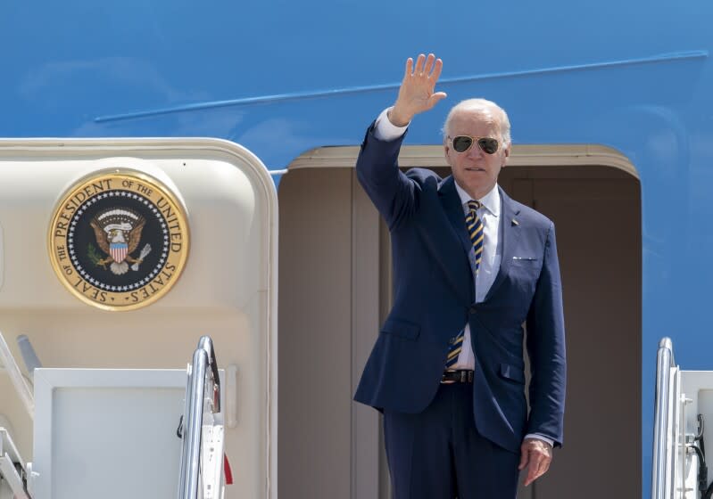 President Joe Biden waves as he boards Air Force One at Andrews Air Force Base, Md., Thursday, May 19, 2022, to travel to Seoul, Korea to begin his first trip to Asia as President. (AP Photo/Gemunu Amarasinghe)