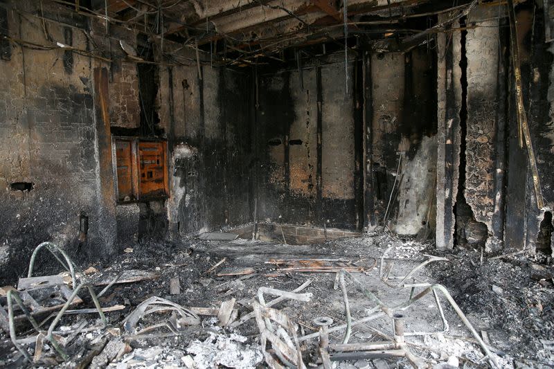 FILE PHOTO: The ruins of a burnt bank are seen after protests against increased fuel prices in Tehran