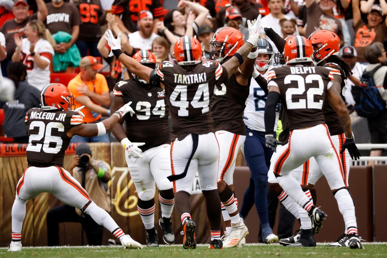 Cleveland Browns defensive end Myles Garrett (95) celebrates with his teammates after sacking Tennessee Titans quarterback Ryan Tannehill (17) on Sep. 24 in Cleveland.