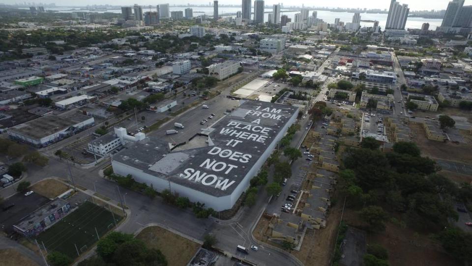Poem on a Miami area neighborhood rooftop during an O, Miami Poetry Festival. Mark Slatko/Knight Foundation