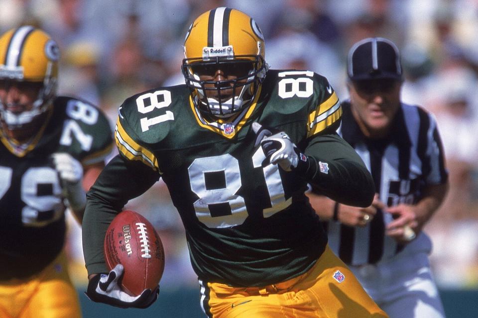 Tyrone Davis #81 of the Green Bay Packers runs with the ball during the game against the Philadelphia Eagles at Lambeau Field in Green Bay, Wisconsin.