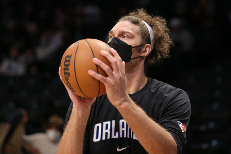 Dec 18, 2021; Brooklyn, New York, USA; Orlando Magic center Robin Lopez (33) wears a mask as he warms up before a game against the Brooklyn Nets at Barclays Center. Mandatory Credit: Brad Penner-USA TODAY Sports